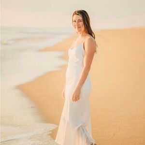 White midi dress, mermaid flair at the base of the dress. Size small. Lulus